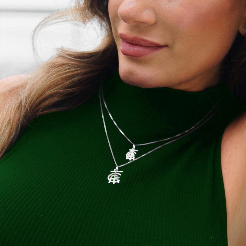 PINGENTE VAZADO ESCUDO AMÉRICA - 2CM